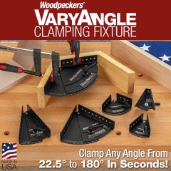 6 different versions of the VaryAngle Clamping Fixtures on workbench. One in use on hexagonal box.